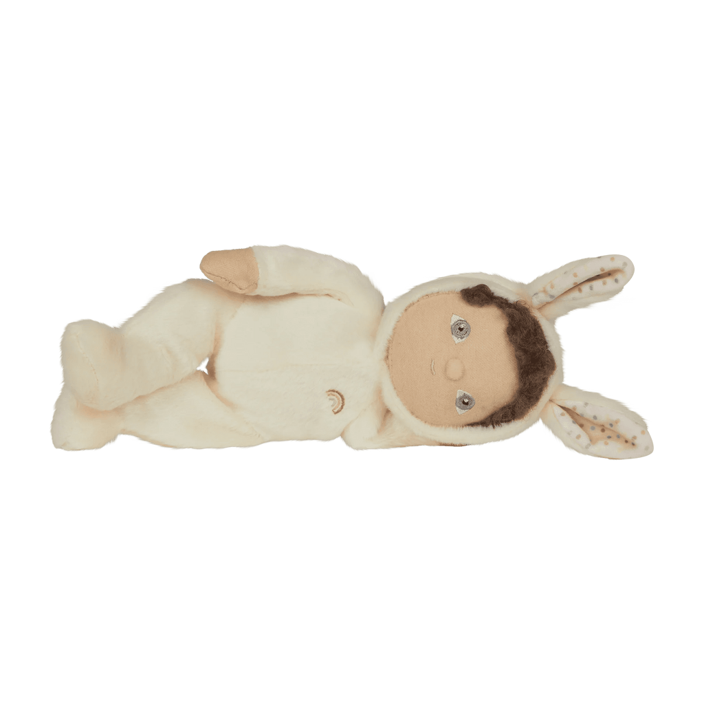 Baby doll in a bunny costume on a white background