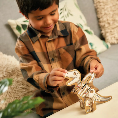 Child playing with a wooden dinosaur toy on a couch