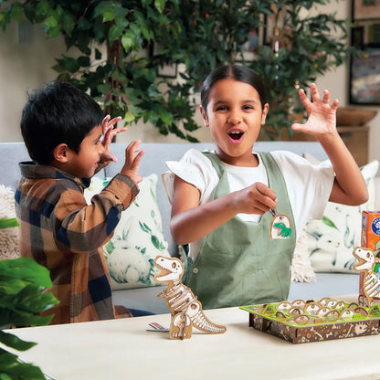 Two children playing with dinosaur game on a table in a home setting.