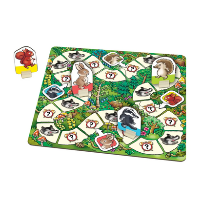 Board game with animal cards on a green forest-themed board