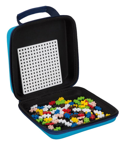 Black carrying case with colorful building blocks on a white background
