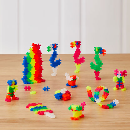 A variety of colorful construction block toys arranged on a table, showcasing different 3D constructions and puzzle configurations.