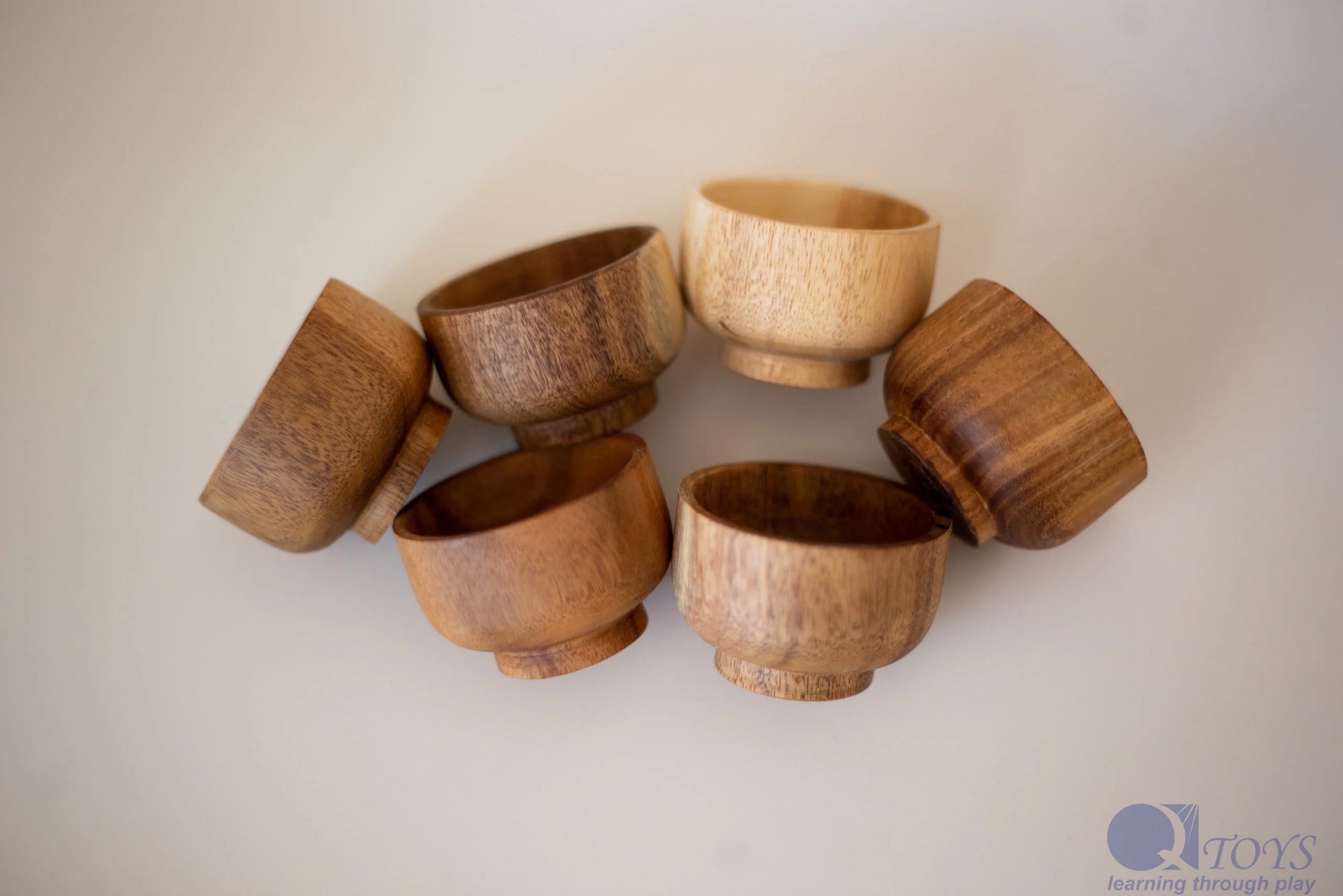 Set of wooden bowls on a light background