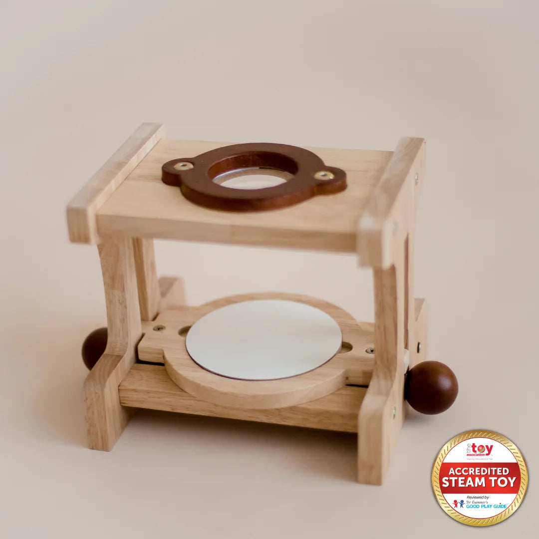 A wooden microscope educational toy made of wood, featuring a stage with knobs, a magnifying lens, and a sturdy base.