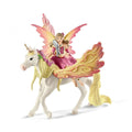 Toy figure of a fairy riding a unicorn with colorful wings on a white background