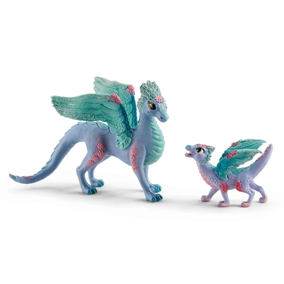 Two toy dragons with blue and green colors on a white background