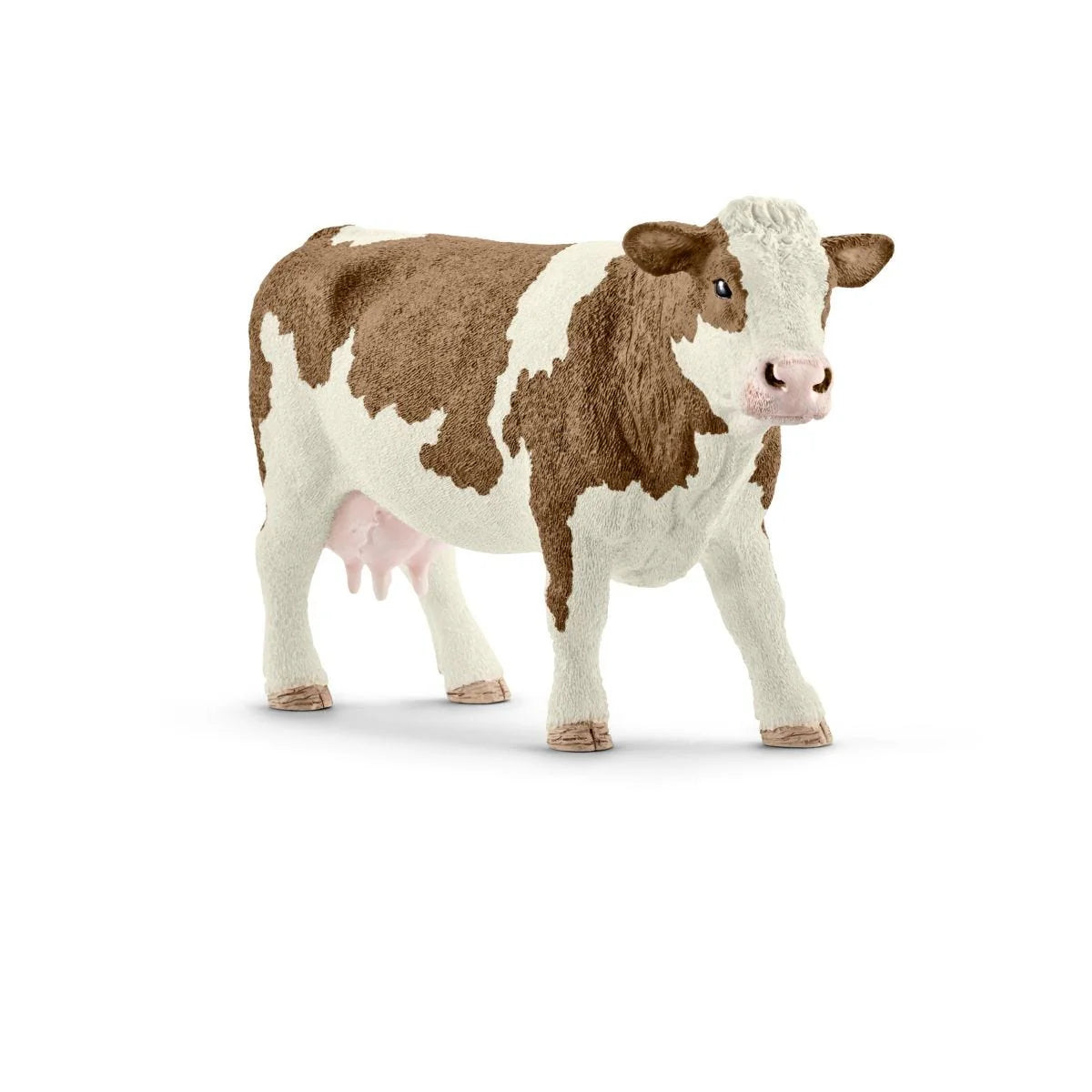 Cow figurine on white background