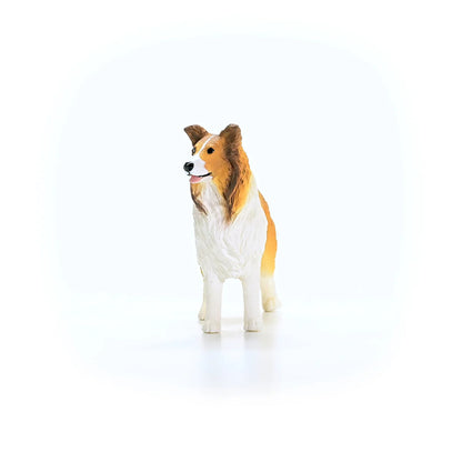 Collie dog figurine on a white background