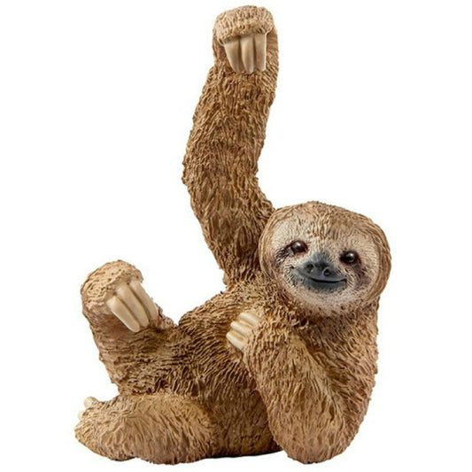 Toy sloth hanging on a white background