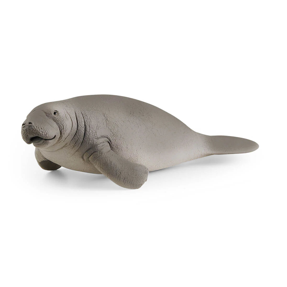 Manatee figurine on white background