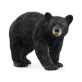 Black bear figurine on a white background