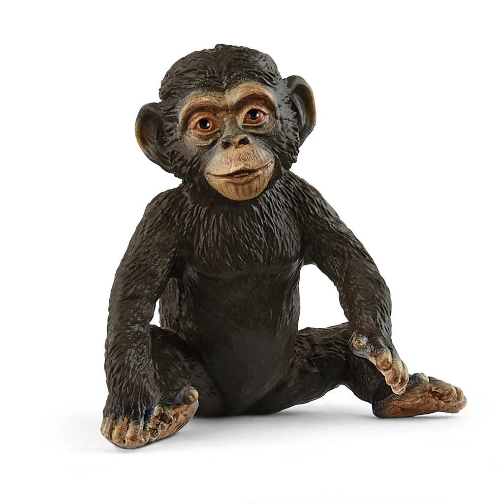 Chimpanzee figurine sitting on a white background
