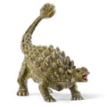 Dinosaur toy figure with a spiked back on a white background