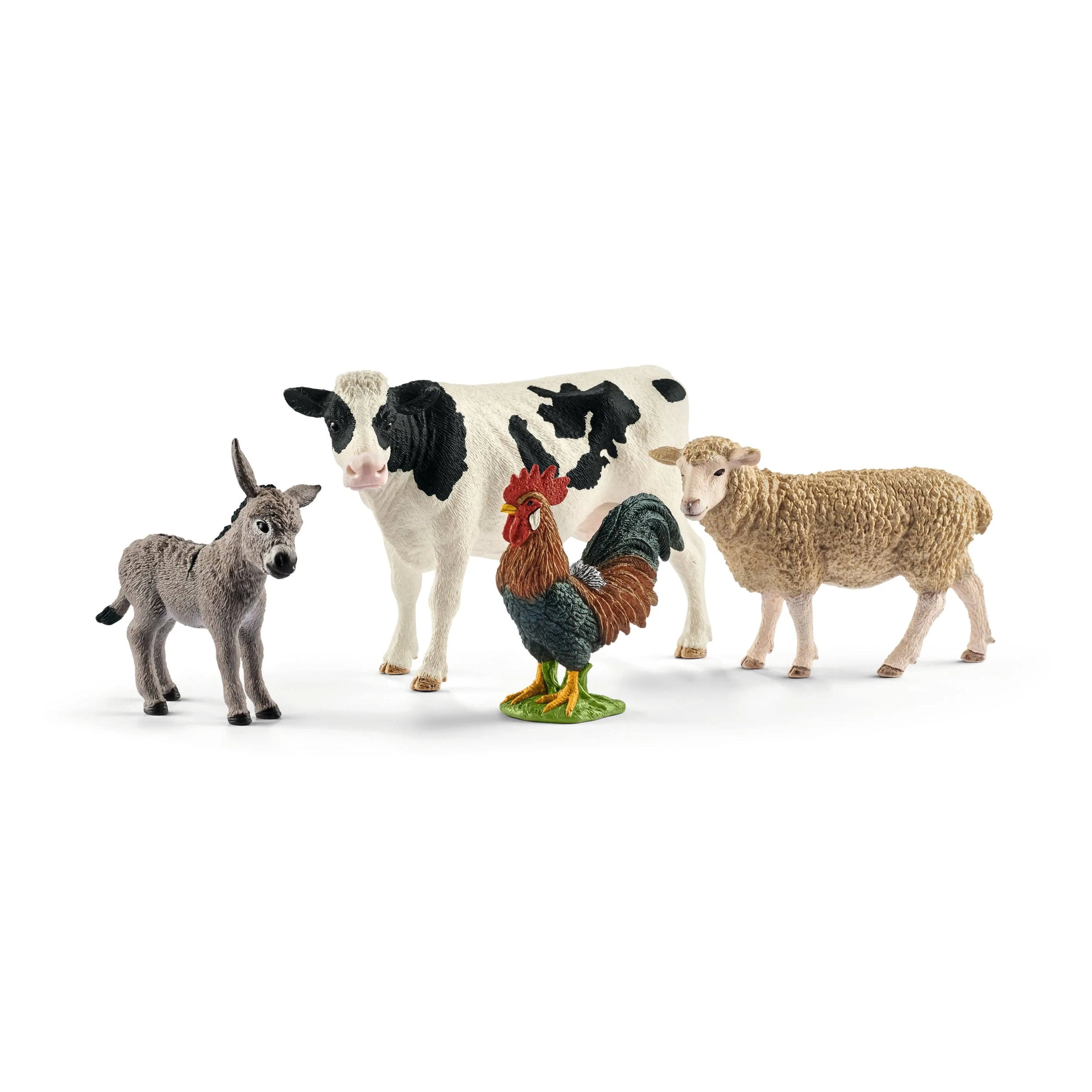 Set of toy farm animals including a cow, sheep, donkey, and rooster on a white background