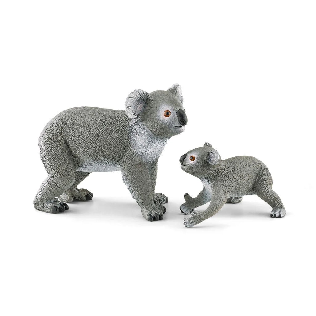 Two koala figurines on a white background