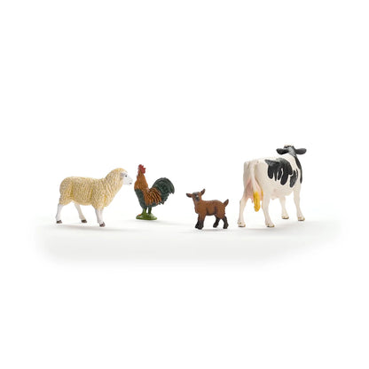 Set of toy farm animals including a sheep, rooster, goat, and cow on a white background