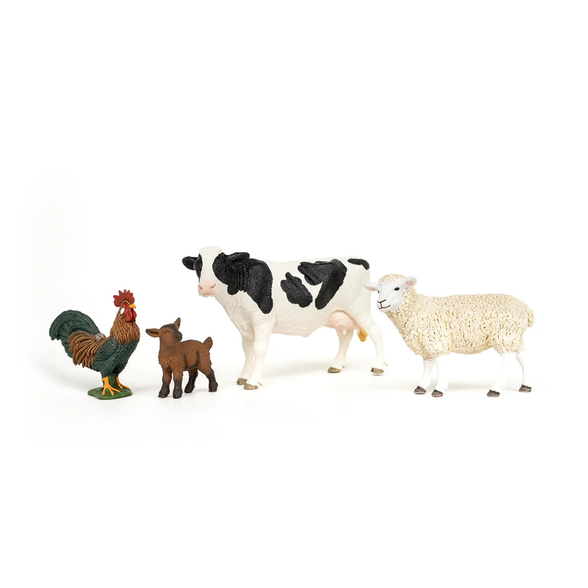 Set of toy farm animals including a rooster, calf, cow, and sheep on a white background