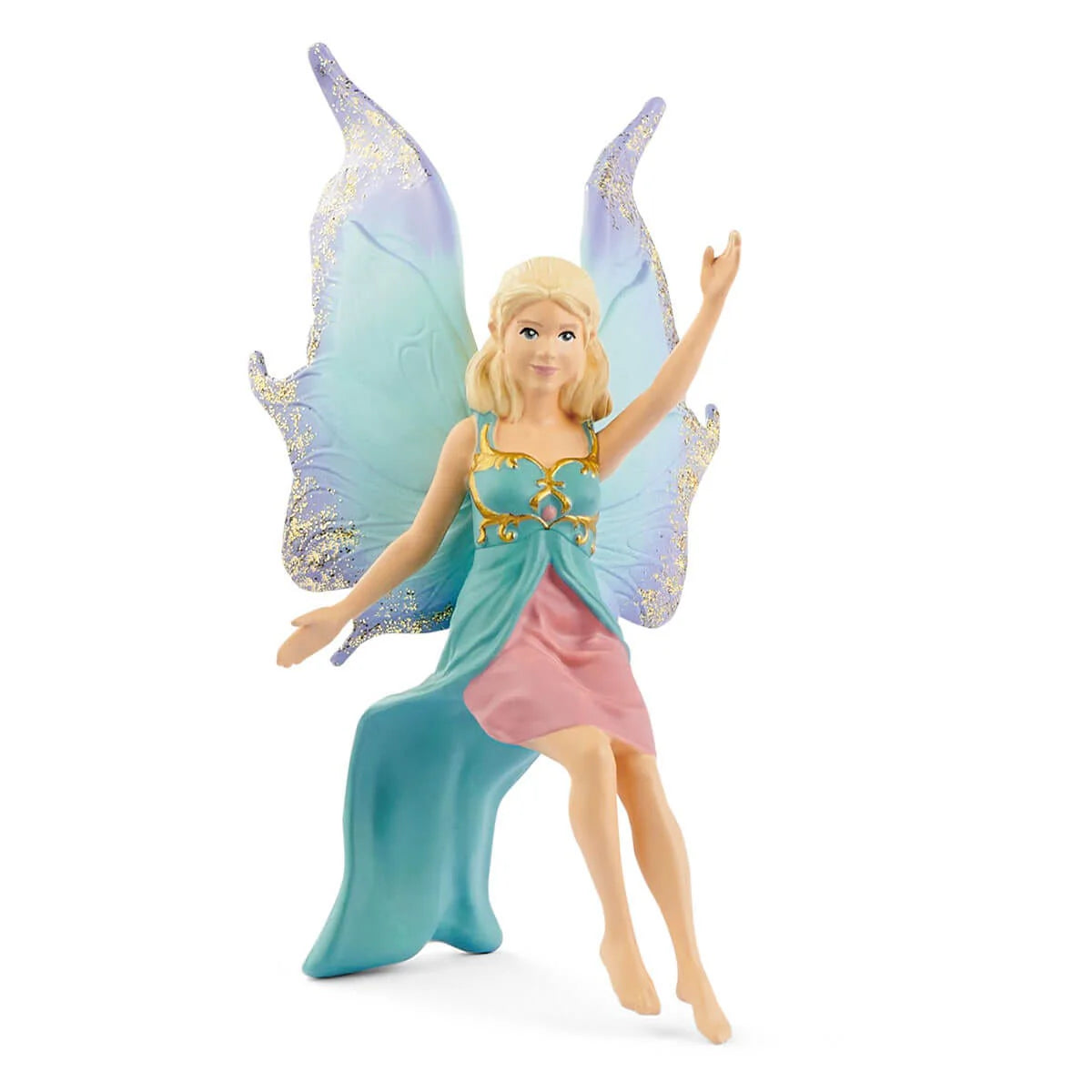 Fairy figurine with blue wings and dress on a white background