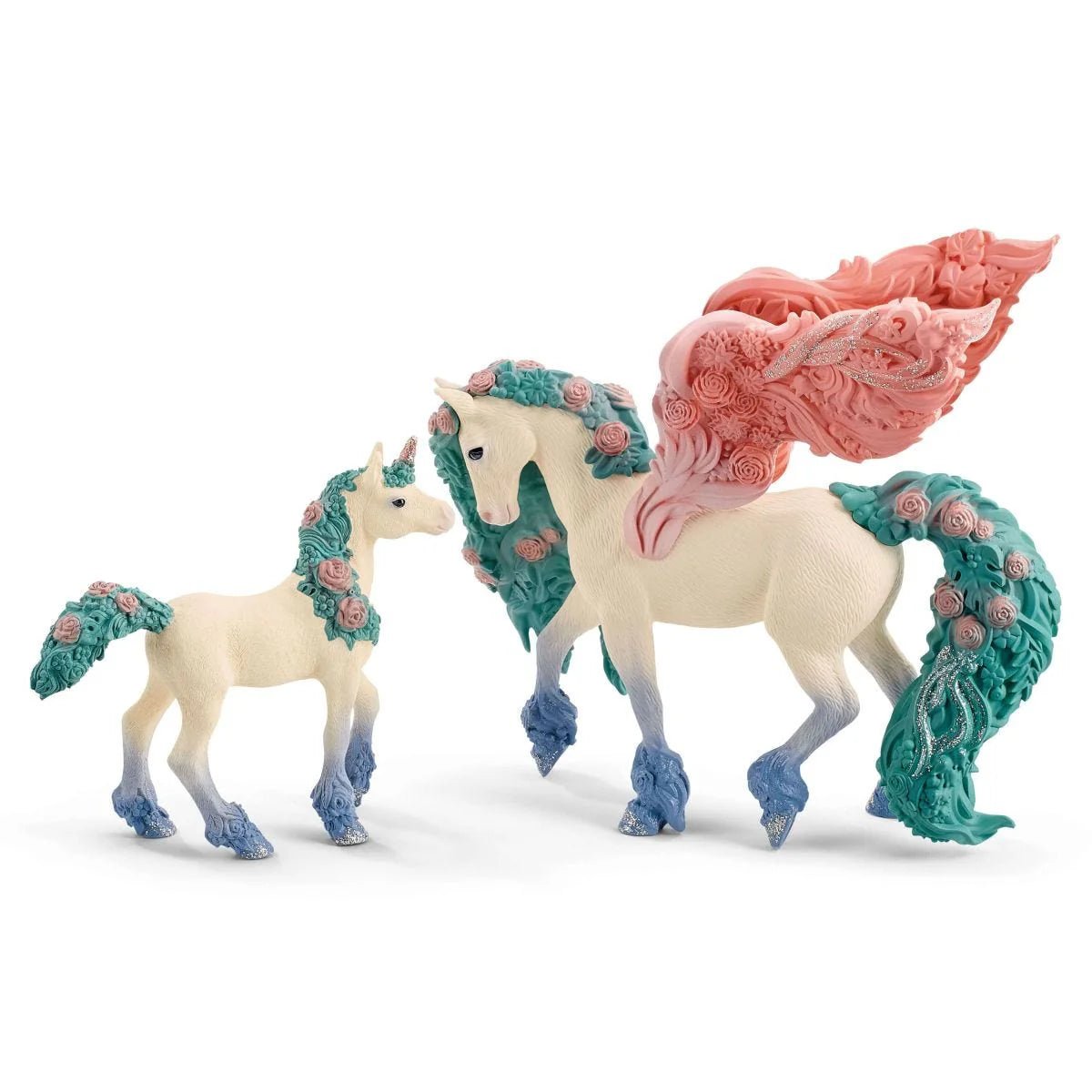 Unicorn figurines with decorative tails and wings on a white background