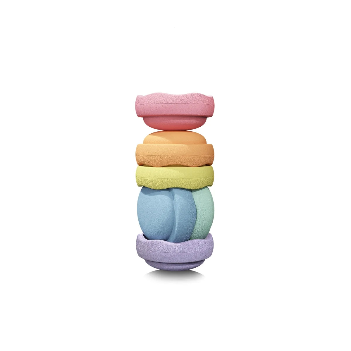 A stack of six pastel-colored, bowl shaped toys on a clean white background.