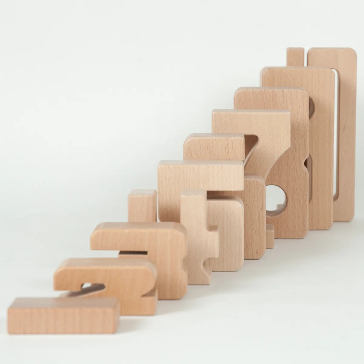 Set of wooden blocks with geometric shapes on a white background