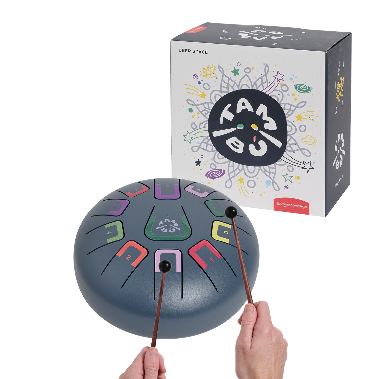 Drum with colorful patterns held by hands, next to its packaging on a white background