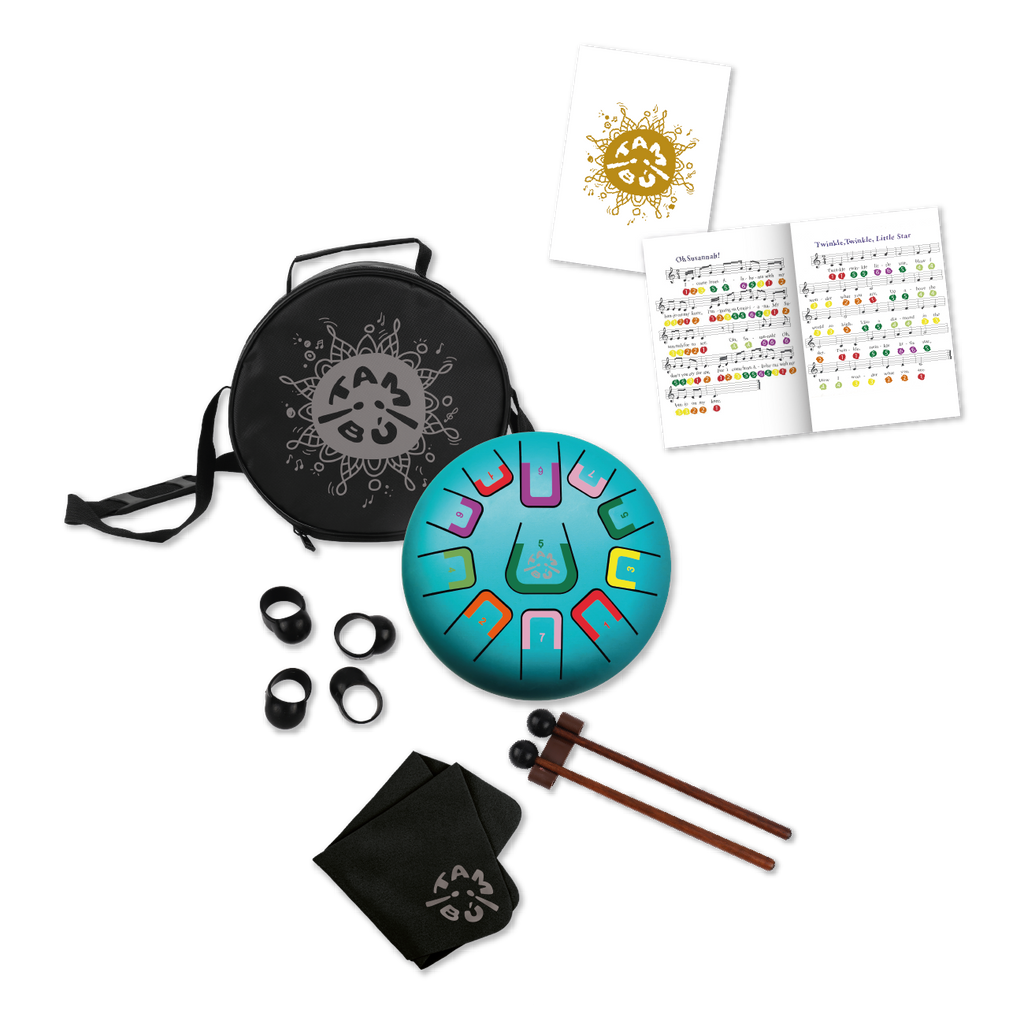 Colorful metal tongue drum set with carrying case, mallets, and instructional materials on a white background