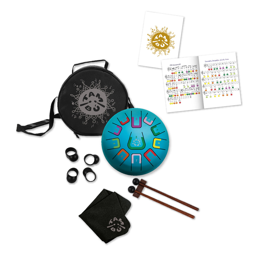 Tangram drum set with carrying case, drumsticks, and music sheets on a white background