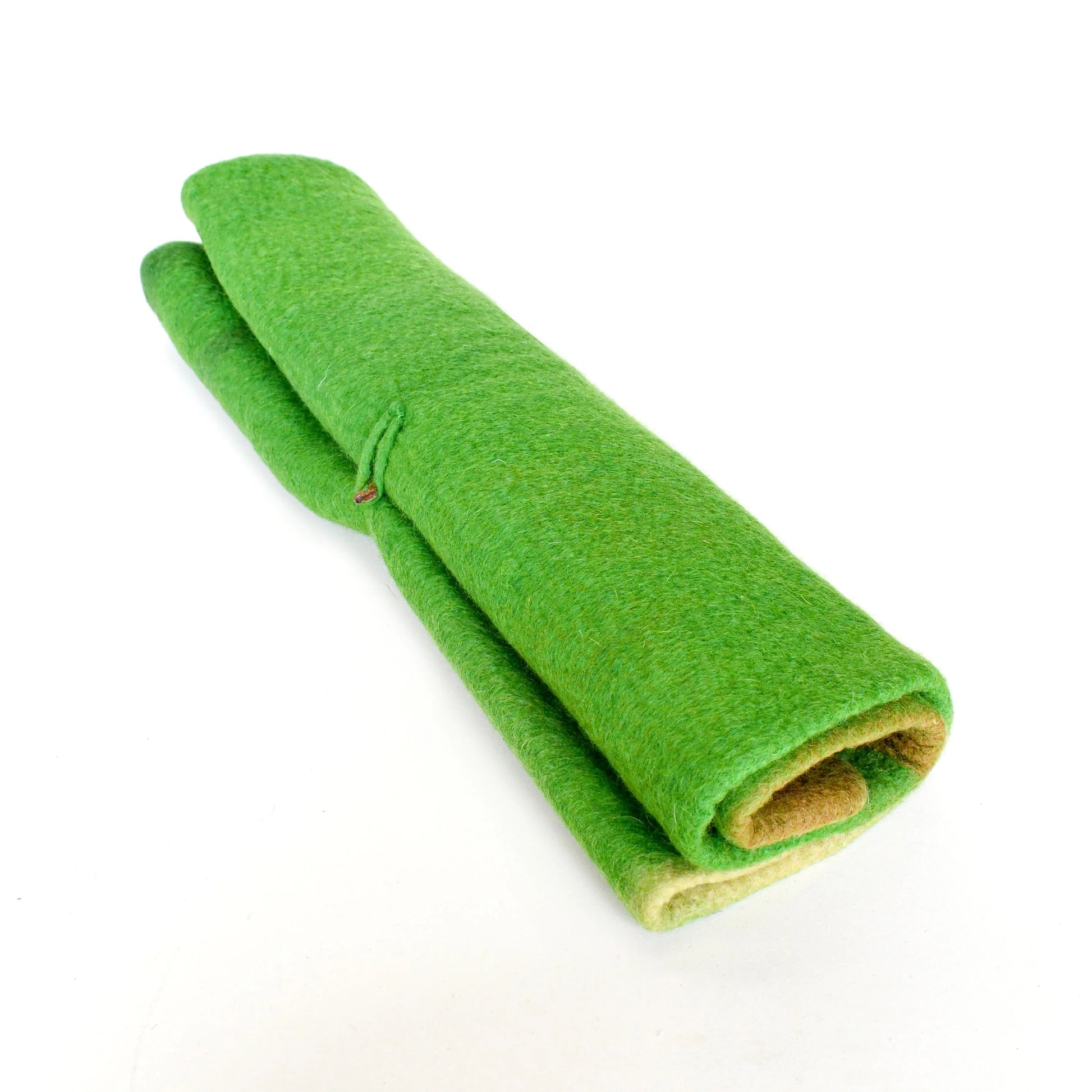 Rolled-up green mat on a white background