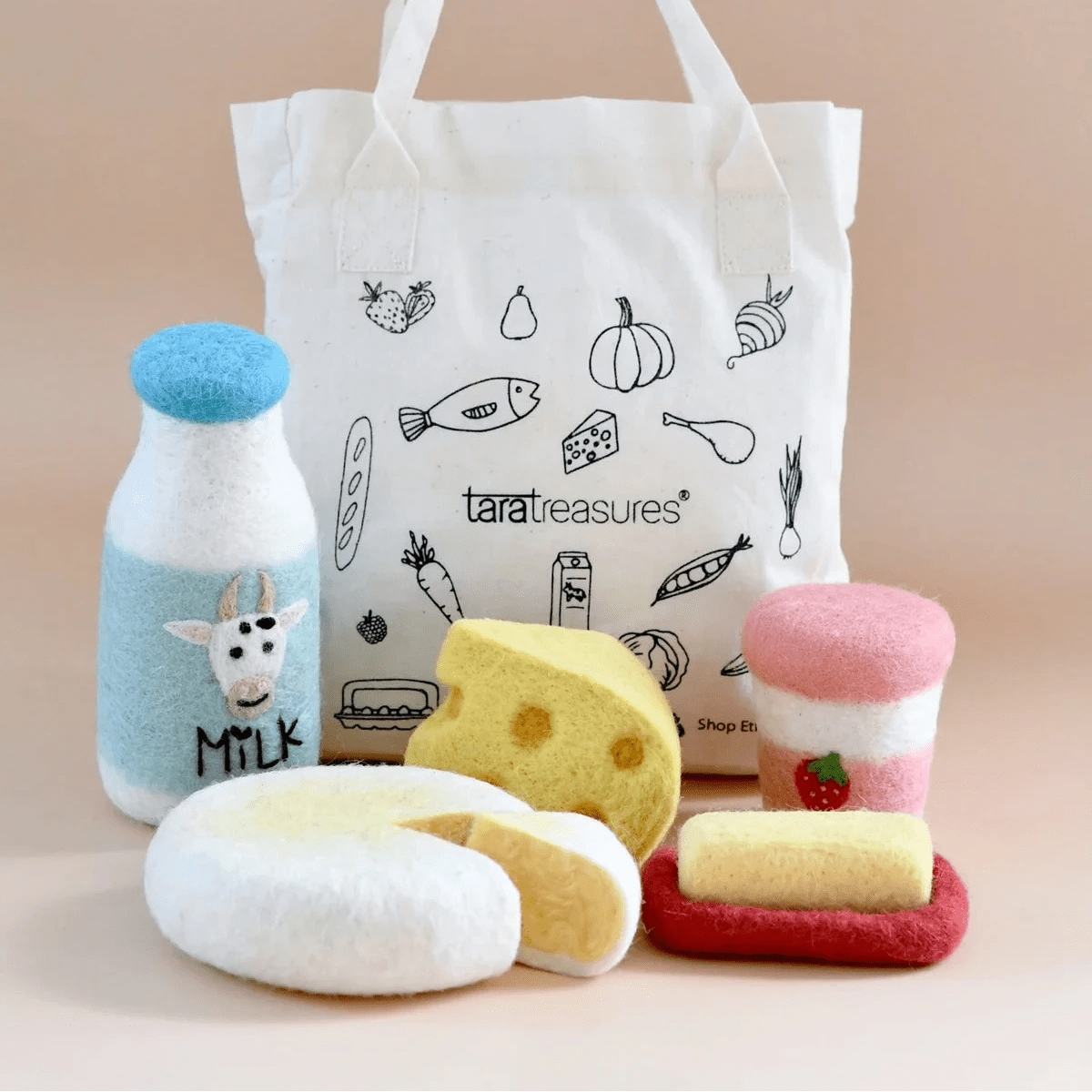 Tote bag with food-themed illustrations and plush toys on a beige background