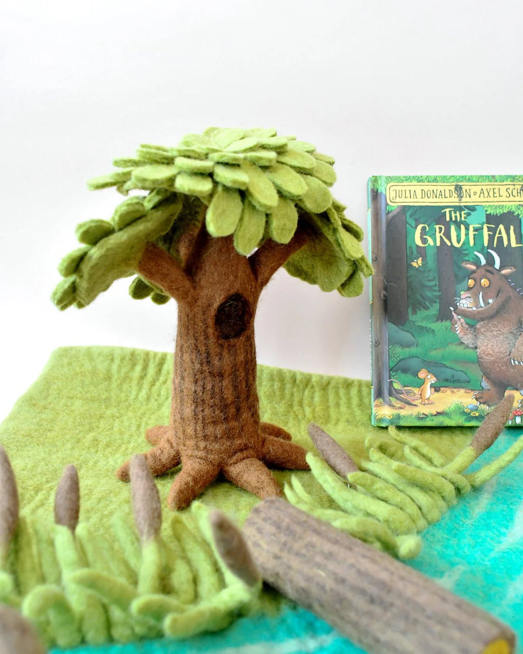 Felt tree with a book titled 'The Gruffalo' on a white background