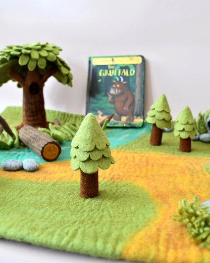 Felt play mat with trees, logs, and a 'The Gruffalo' book