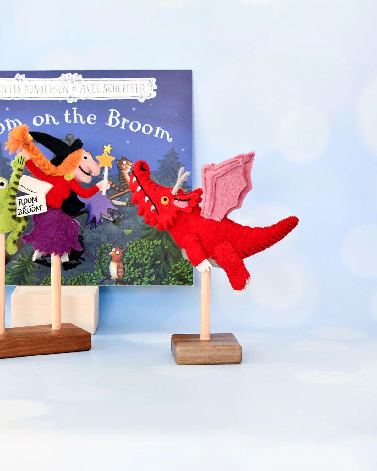 Red dragon toy with witch and cat on a 'Room on the Broom' book