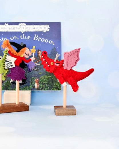 Red dragon toy with witch and cat on a 'Room on the Broom' book