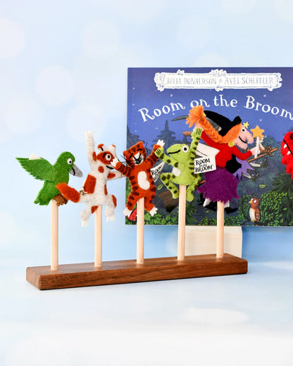 Felt character puppets on sticks with a 'Room on the Broom' book in the background.