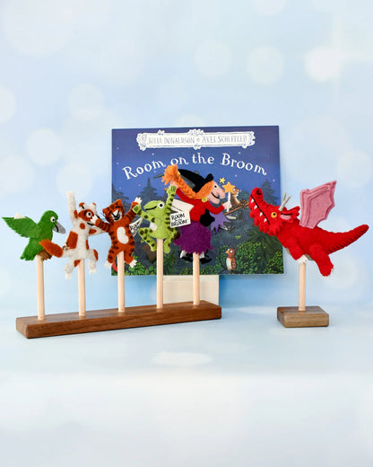 Felt character puppets on sticks with a 'Room on the Broom' book in the background.