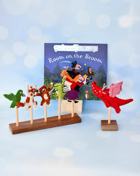 Felt character puppets on sticks with a 'Room on the Broom' book in the background.