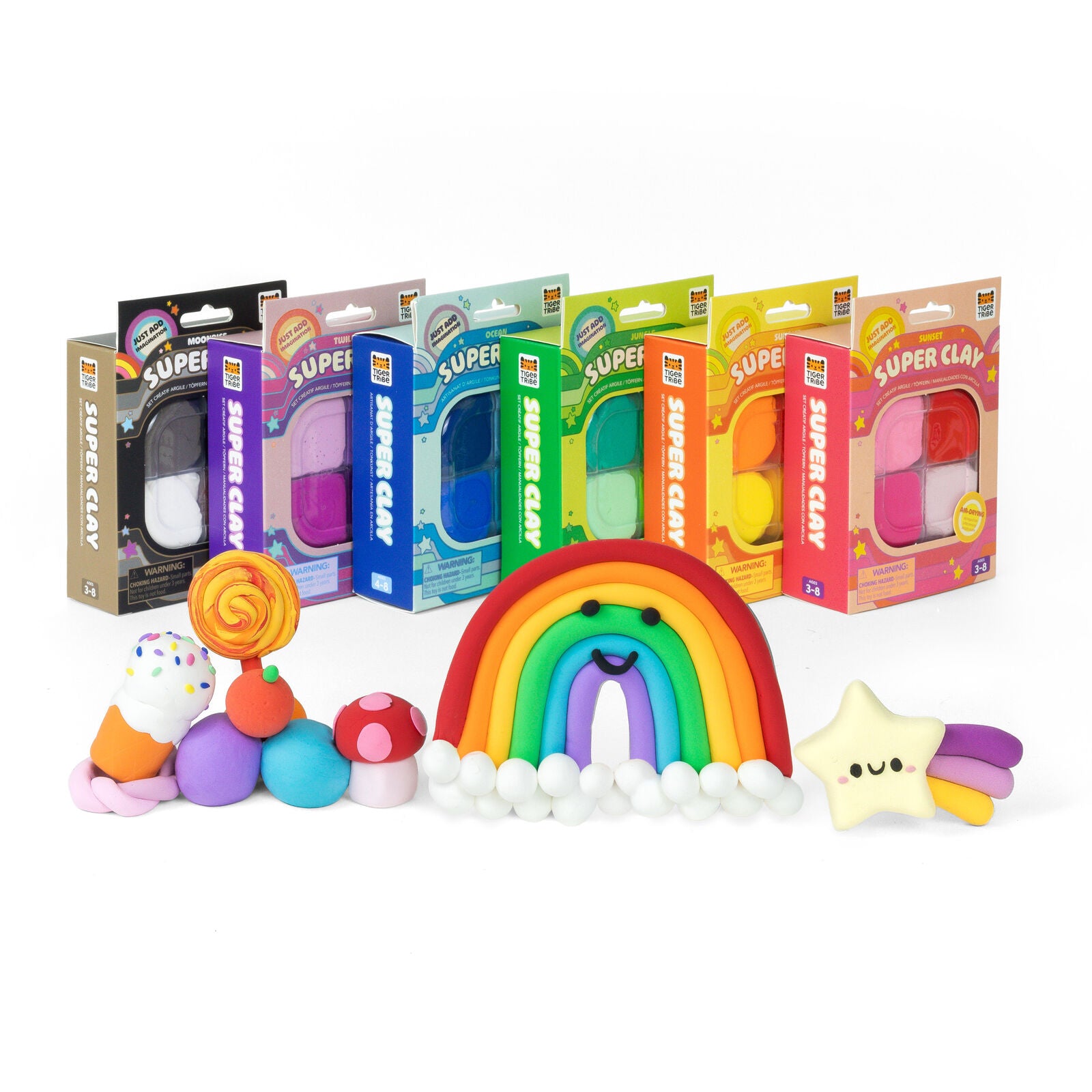 Colorful Super Clay packages and clay models on a white background