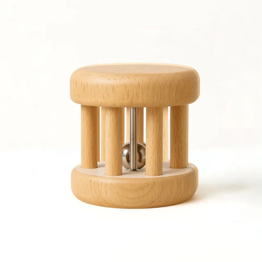 Wooden baby rattle on a white background