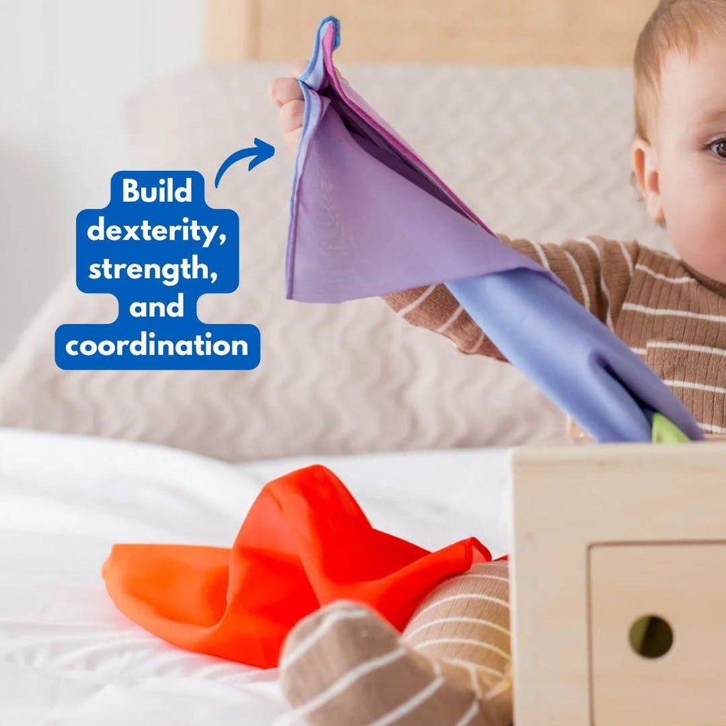 Baby playing with Totli Box