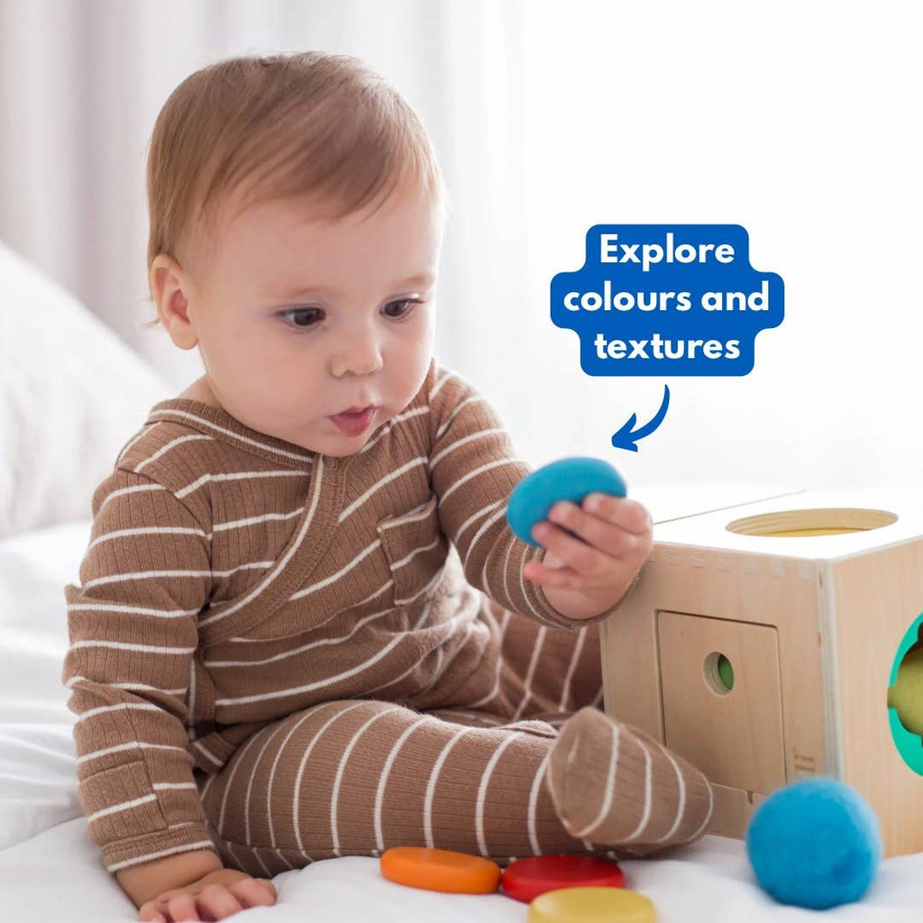 Baby playing with Totli Box