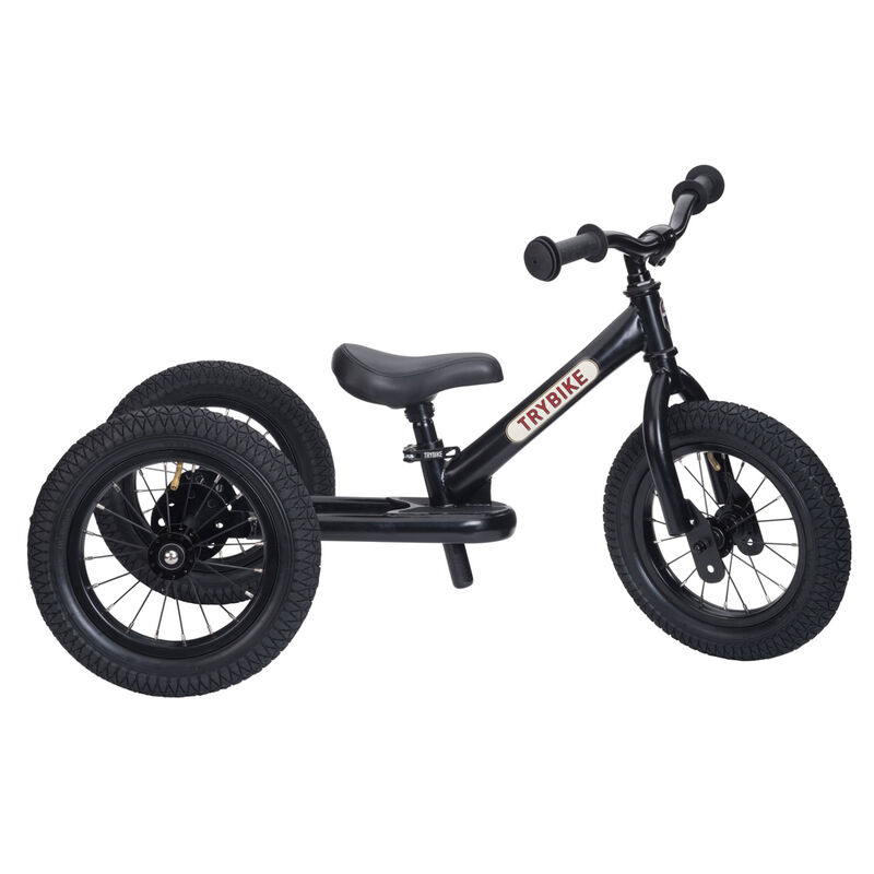 Black balance bike with a visible brand logo on a white background