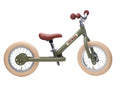 Children's balance bike with brown seat and wheels on a white background