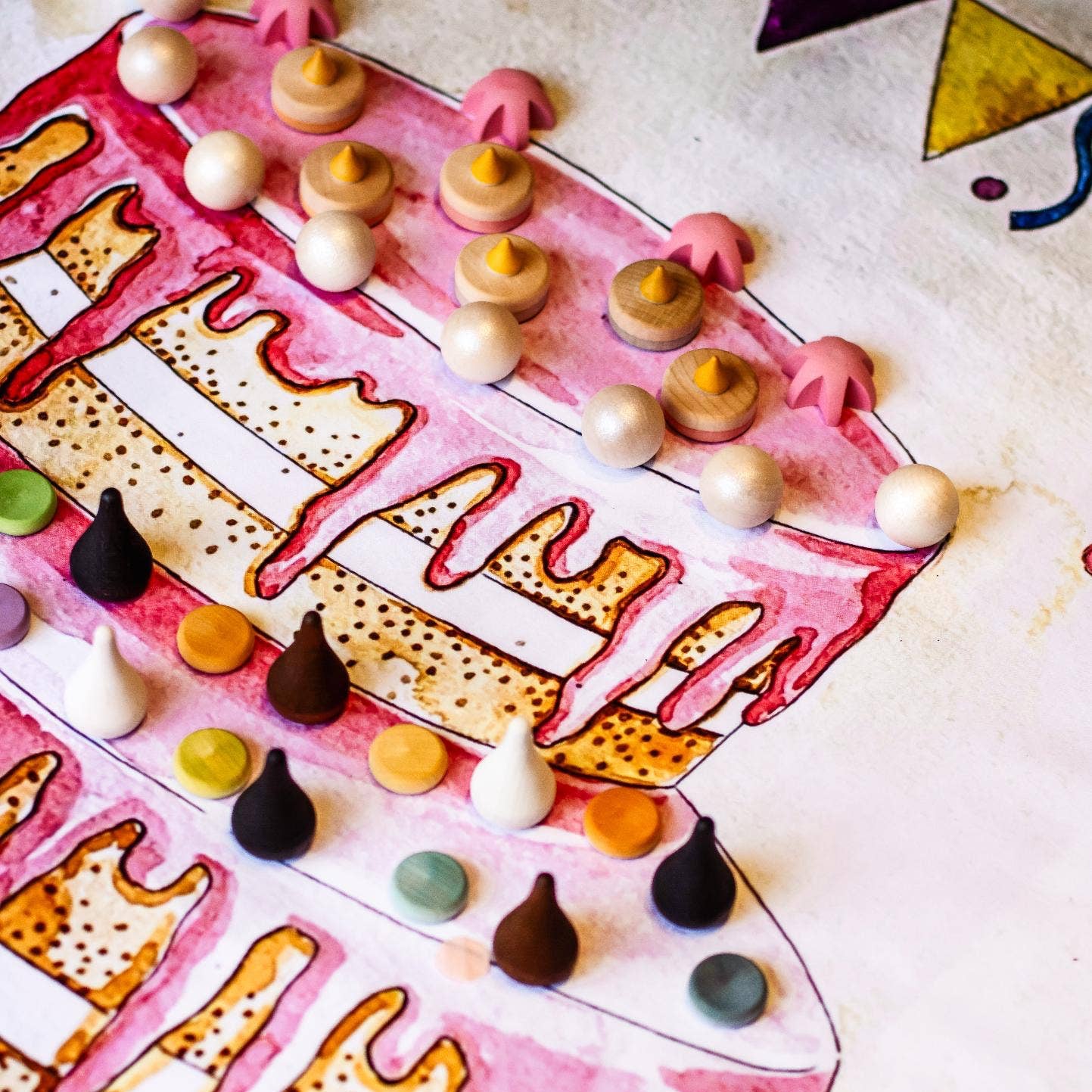 Decorative paper with colorful candy decorations on a white background