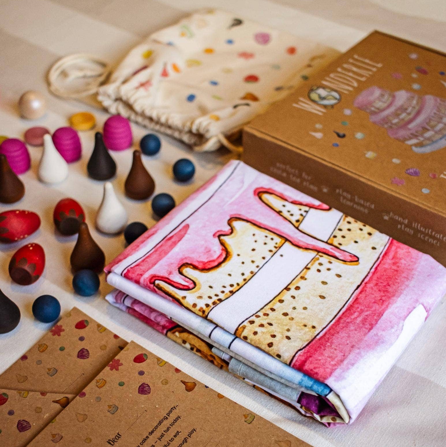 Colorful playdough set with tools and packaging on a wooden surface